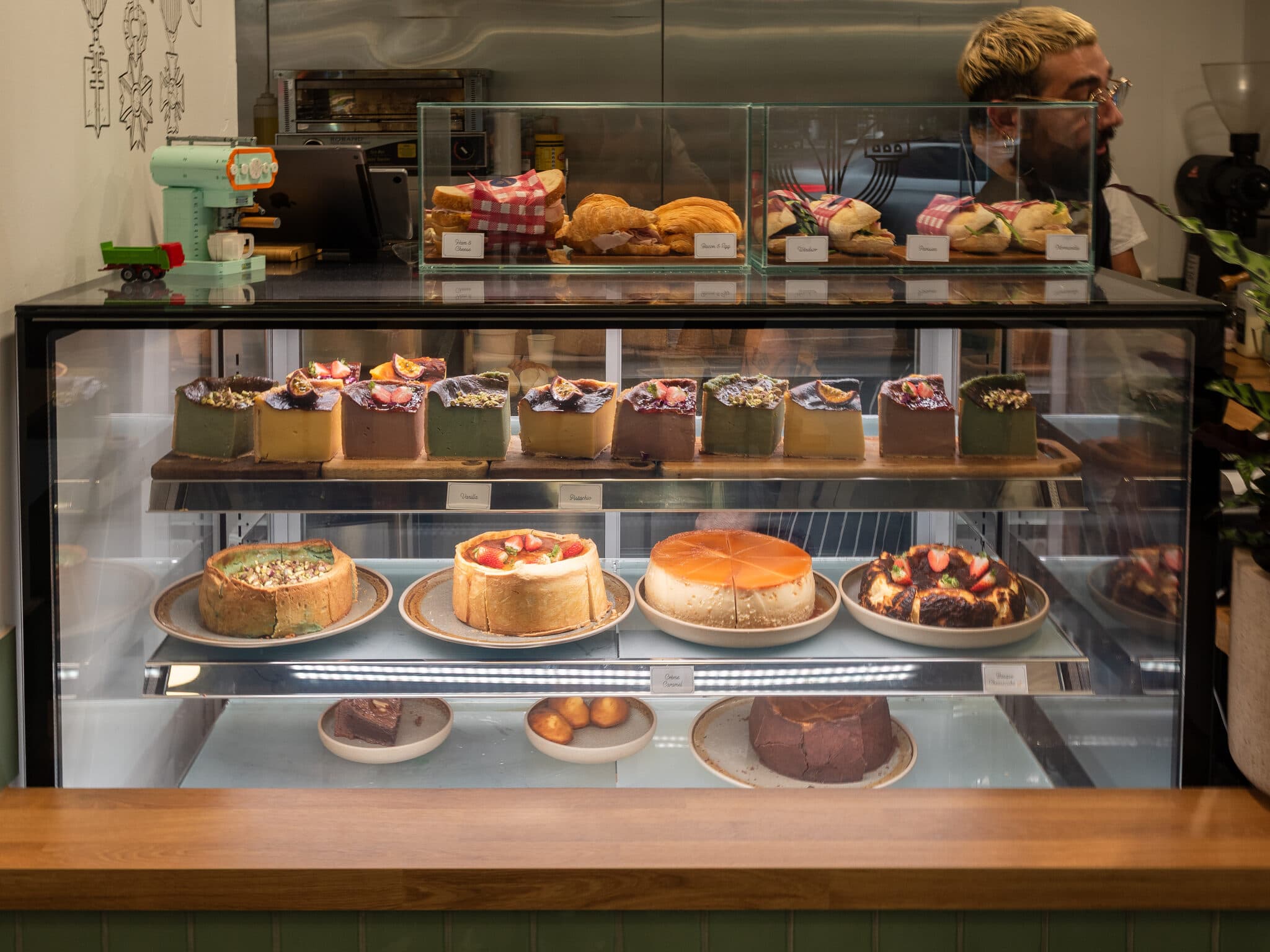 The Anaïs pastry display case with sandwiches and cakes