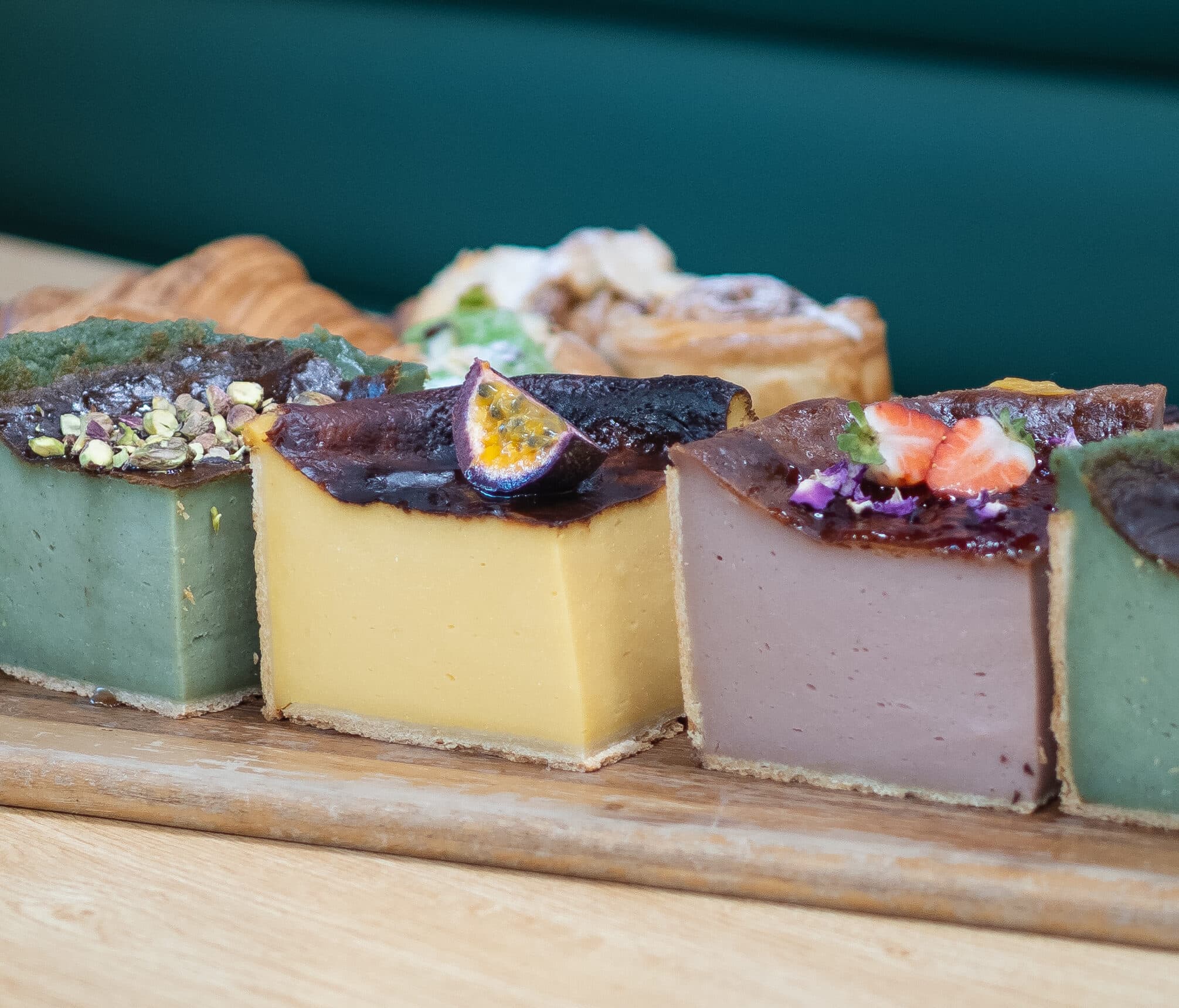 A tight close-up of decorated Anaïs dessert squares