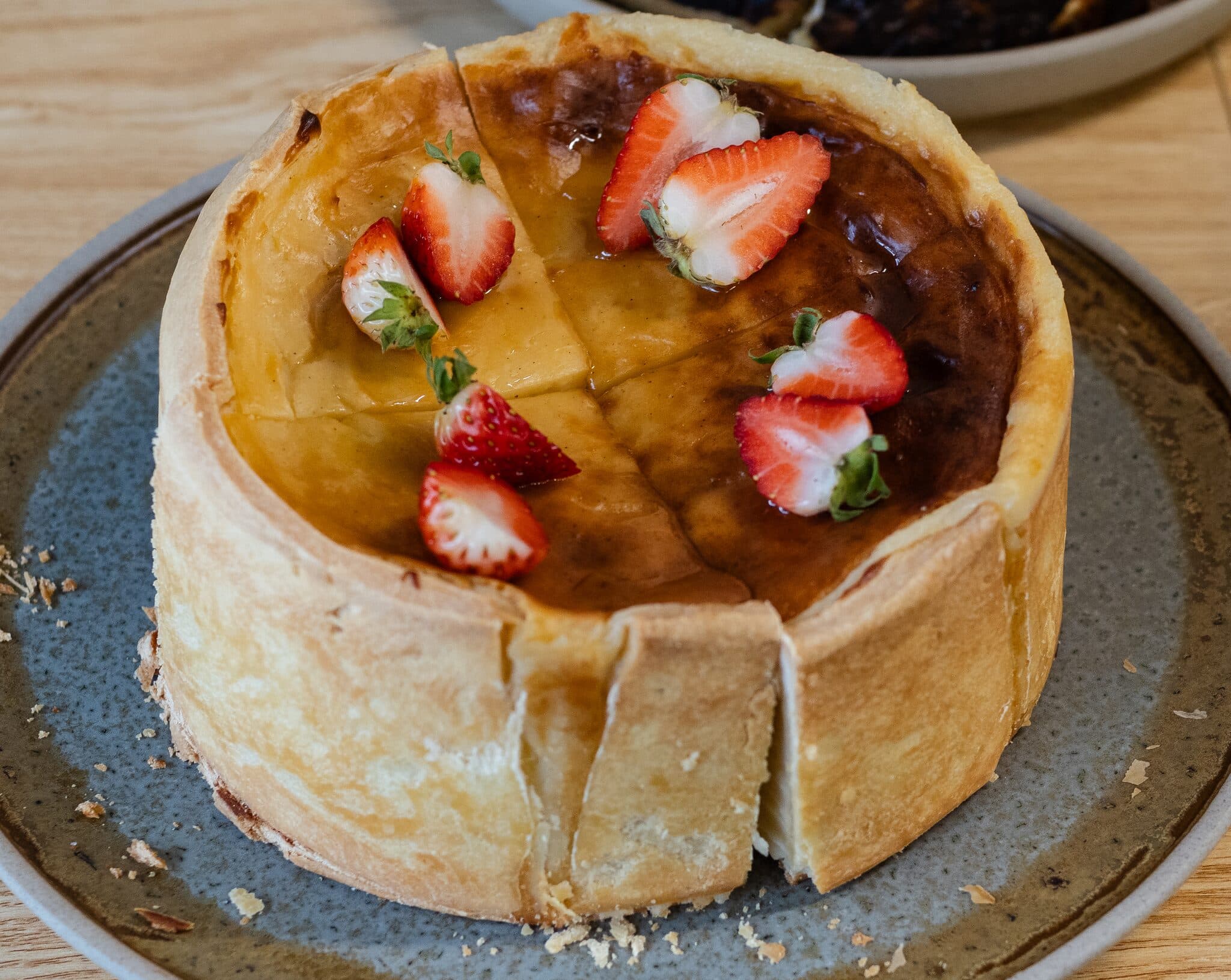 A strawberry-topped house-made Anaïs pastry, close-up