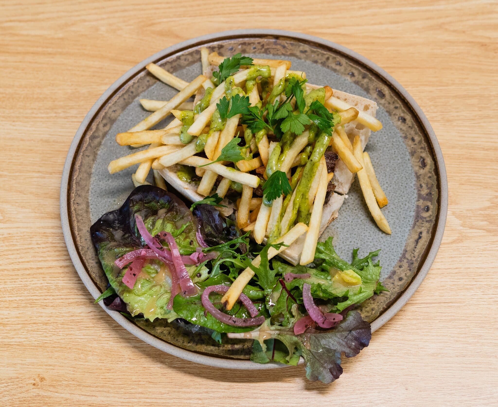 A plated salad and fries